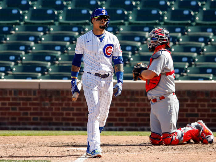 Aug 19, 2020; Chicago, Illinois, USA; Chicago Cubs shortstop Javier Baez (9) reacts after striking out against the St. Louis Cardinals during the fifth inning at Wrigley Field.